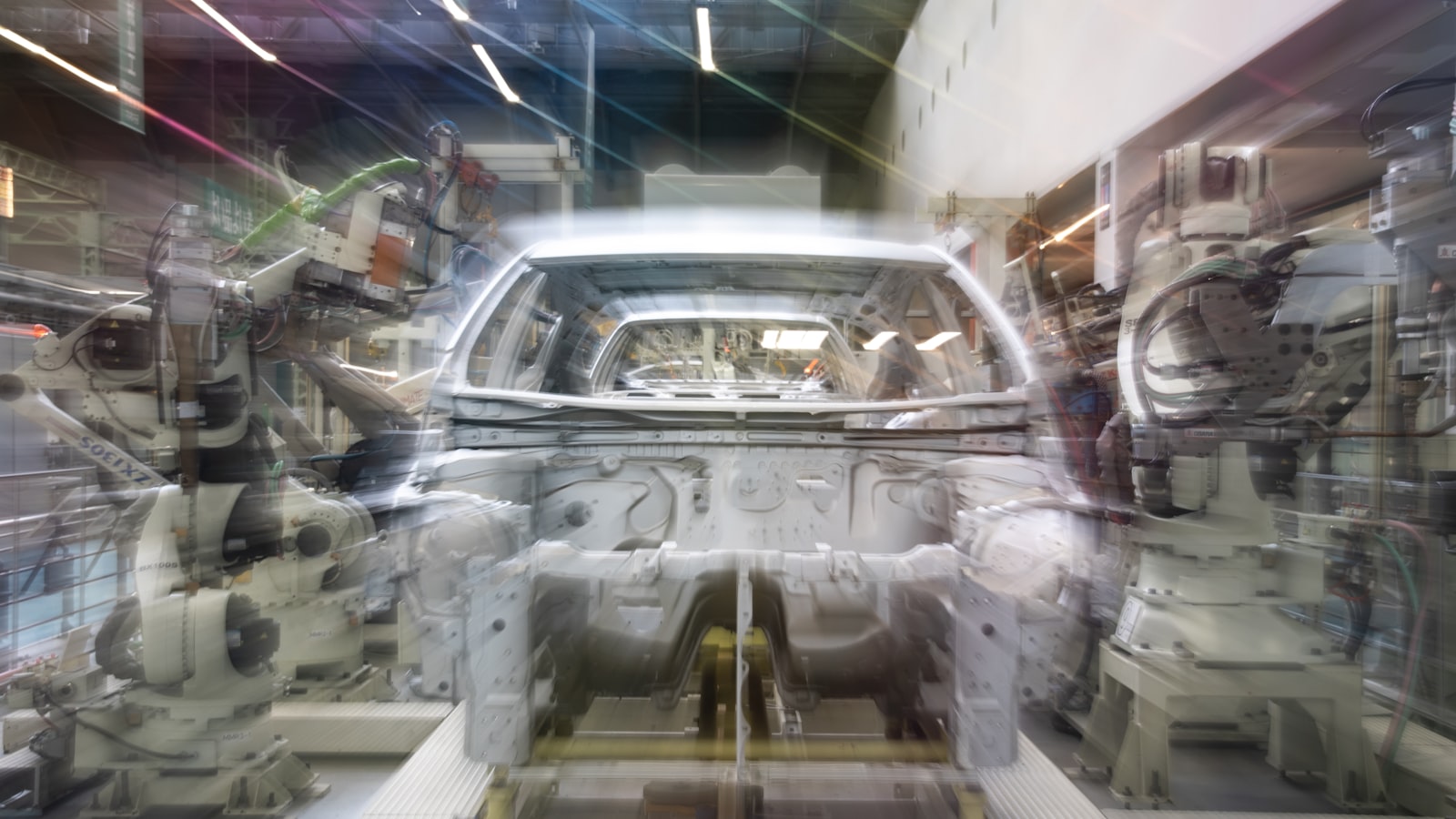 photo-1777642328916-d96fc156f32b Automatisierte Roboterarme, Symbolbild für Agentic Marketing